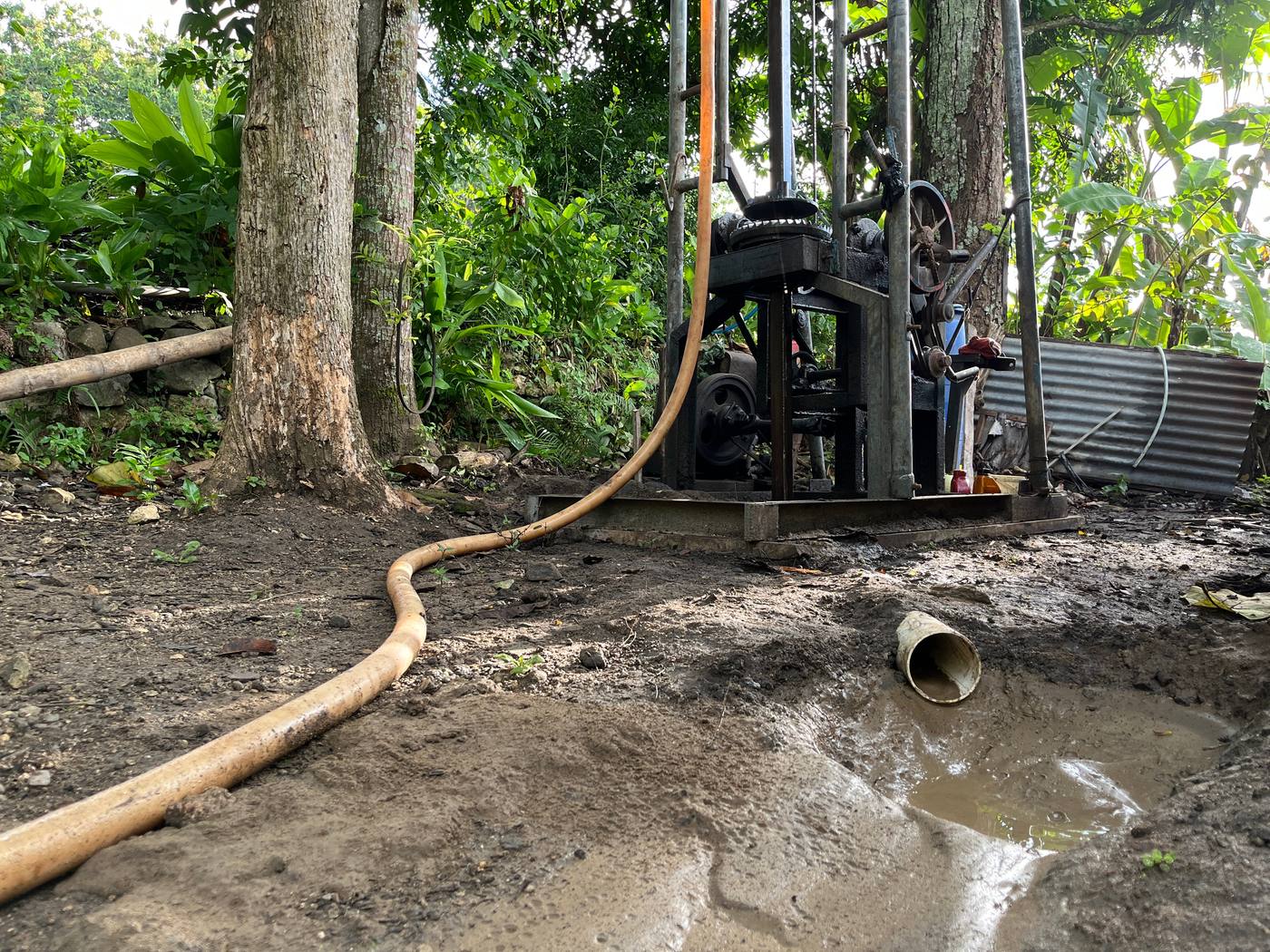 Small cable-tool drilling rig at work on a remote site